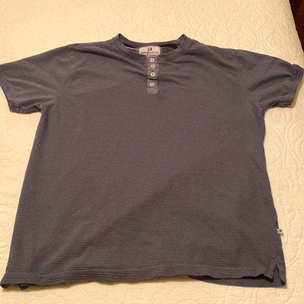 Size large thread and cloth button up tee